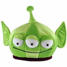 a green stuffed toy with big eyes and ears on it's head that says, click for enlarged view