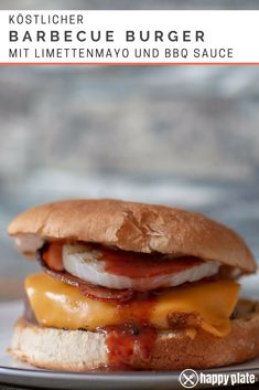 a cheeseburger with bacon and egg on a bun