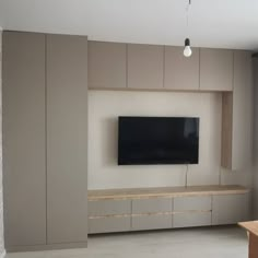 a flat screen tv mounted to the side of a wall