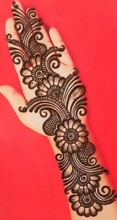 a hand with henna on it