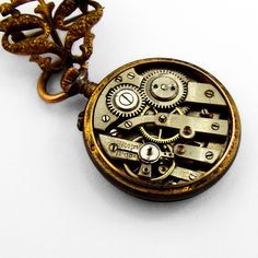 "Antique small open face Swiss pocket watch, having round form 800 silver case, decorated with light blue guilloche enamel. On the back, there are gold floral patterns with a bird in the middle. Watch has white color face with black Arabic numerals, gold dot hour marks and two hands. It comes with a gold-filled figural scroll form watch pin. This glorious watch is 1 1/16\" in diameter, pin is 7/8\" tall and 13/16\" wide. Watch needs cleaning. Eb9327" Formal Metal Pocket Watch With Skeleton Dial, Antique Gold Pocket Watch With Skeleton Dial, Victorian Style Chronometer Watch For Gift, Victorian Style Chronometer Watch As Gift, Steampunk Pocket Watch With Metal Dial, Steampunk Style Metal Dial Pocket Watch For Gift, Steampunk Pocket Watch With Metal Dial As Gift, Vintage Medallion Pocket Watch With Skeleton Dial, Steampunk Style Pocket Watch With Metal Dial As Gift