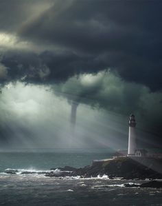 the lighthouse is surrounded by dark storm clouds