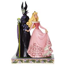 a figurine of two people dressed as disney and maleficent