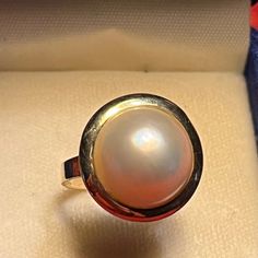 This 16mm Diameter Mabe Pearl Ring Is Set In A 14kt Yellow Gold Back Caged And Smooth Top Bezel Mounting. No Prongs To Snag, Yet Mounted Without Glue Or Drilling Holes. It Is Classic Beauty And Elegant Design At Its Best. In Excellent Condition From A Pampered Jewelry Box. All Reasonable Offers Considered. Bundle With Other Items For Savings. Message Me With Questions. Fast Shipping. Thank You For Stopping By My Closet! Fine Jewelry | Heirloom Jewelry | 14kt Gold And Pearl | Bridal Jewelry | Gra Pearl Bridal Jewelry, Mabe Pearl, Heirlooms Jewelry, Drilling Holes, Yellow Gold Pendants, Yellow Gold Ring, Classic Beauty, Pearl Ring, 14kt Gold