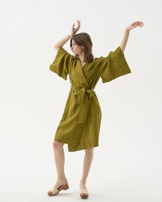 "Midi linen kimono robe -- wear it as a wrap dress, or as a lush cardigan. Offered in medium-weight and exclusive linen. If you're interested in short & long options, check our robes SUNRISE & NOON. STYLE DETAILS * Loose fit * Kimono collar & sleeves * Belt included * With pockets * Above-the-knee length * Made from medium-weight and exclusive linen SIZES & COLORS IN THE PICTURES * Model is wearing a size S/M in Olive Green (medium) linen Model's height - 174 cm (5' 8\"), bust - 80 cm (31.5\"), Spring Wrap Robe With Relaxed Fit, Linen Wrap Robe For The Beach, Linen Wrap Robe For Beach, Elegant Linen Summer Kimono, Elegant Linen Kimono For Summer, Linen Robe For Daywear, Linen Wrap Kimono For Vacation, Linen Kimono With Kimono Sleeves For Loungewear, Vacation Linen Wrap Kimono