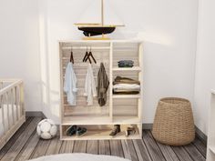 a baby's closet with clothes and shoes on the floor next to a crib