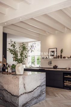 the kitchen is clean and ready to be used as a dining room or living room