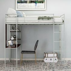 a loft bed with a desk underneath it