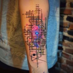 a person with a tattoo on their arm has a colorful design on his left arm