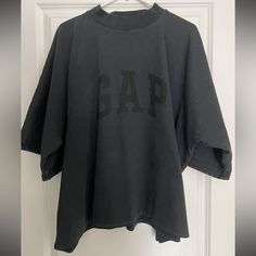 Great Condition Gap T-shirt With Letter Print For Streetwear, Gap Sporty Relaxed Fit Tops, Sporty Gap Tops With Letter Print, Sporty Letter Print Tops By Gap, Sporty Letter Print Tops From Gap, Gap Black Cotton Tops, Black Cotton Gap Tops, Black Relaxed Fit Top From Gap, Black Relaxed Fit Top By Gap