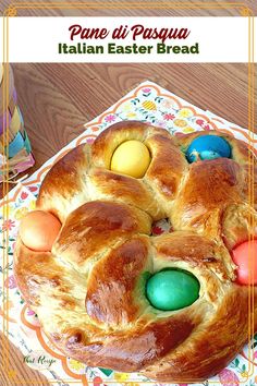 an easter bread with eggs in it on a plate