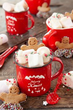 two red mugs filled with marshmallows and pretzels - stock photo - images