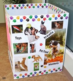 a box with pictures of dogs on it and paw prints around the top, along with words that read toys pets pet food blankets