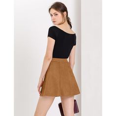 Sleek, simple, and short, this skirt exudes 70s-style charm thanks to wide panels of soft fabric, exposed button closure, and vintage coloring. This skirt features a buttoned front and flaunts an A-line silhouette. It is perfect for pairing with booties and a simple chic top. The skirt with comfortable fabric is paired perfectly with pretty chic heels for a fashionable and sophisticated look. Chic Short Skirt In Solid Color, Chic Solid Color Mini Skirt, Chic Short Solid Color Skirt, Chic Short Length Solid Color Skirt, Chic Brown A-line Bottoms, High Waist Relaxed Mini Skirt, Chic Brown A-line Skirt, High-waist Brown Mini Skirt, Chic Flared Skirt Bottoms With Button Closure