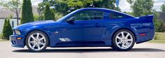 a blue sports car parked in a parking lot