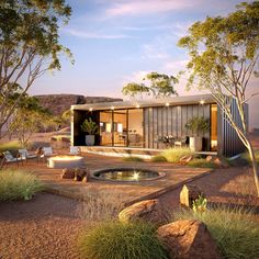 an artist's rendering of a house in the desert with trees and shrubs surrounding it