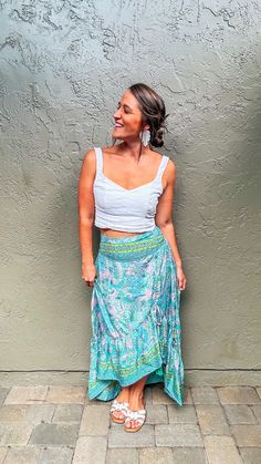 Let your style shine this summer with our Ella Boho Skirt! This lovely little number is perfect for sunny summer days and long summer nights. The bright, cheerful colors are sure to put a smile on your face. The pink and teal paisley pattern comes alive with pops of lime green in the intricate detailed border. Whether you’re headed to a beach bonfire or going to the park with friends, this skirt will keep you looking stylish yet comfy. Crafted from lightweight and comfortable fabrics, its flatte Summer Vacation Boho Print Maxi Skirt, Summer Boho Print Maxi Skirt For Vacation, Boho Print Maxi Skirt For Summer Vacation, Summer Flowy Boho Print Maxi Skirt, Summer Boho Print Tiered Maxi Skirt, Summer Hippie Skirt For Vacation, Hippie Summer Vacation Skirt, Hippie Skirt For Summer Vacation, Summer Vacation Hippie Skirt