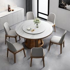 a dining table with six chairs around it