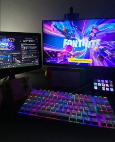 two computer monitors sitting next to each other on top of a desk in front of a keyboard and mouse