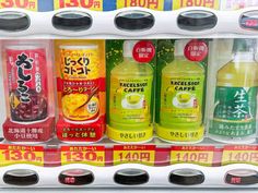 a vending machine filled with lots of different types of drinks in each bottle and on top of each other