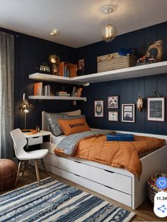 a bedroom with blue walls and white shelves