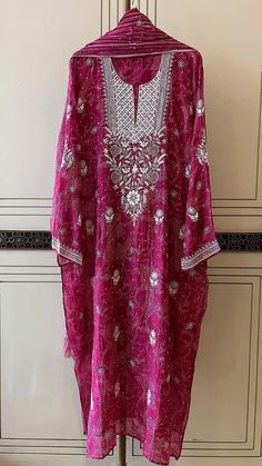 Discover the timeless charm of our Pure Cotton Silk Kurta Set, an epitome of elegance and grace. This luxurious ensemble features vintage chikankari embroidery, beautifully embellished with delicate pearls, cut dana, and shimmering sequins, creating a dazzling masterpiece that exudes sophistication. The kurta comes paired with a matching dupatta, seamlessly blending tradition with modern style. Lined for comfort, the set offers the flexibility of choosing between chic churidhaar or stylish pants as bottoms. Available for customization to any size, this kurta set promises a perfect fit. Kindly send your size specifications before placing your order to ensure a bespoke experience. Elegant Salwar Kameez With Chikankari Embroidery For Reception, Elegant Chikankari Embroidered Salwar Kameez For Reception, Elegant Reception Salwar Kameez With Chikankari Embroidery, Chikankari Embroidered Chinon Kurta For Reception, Transitional Reception Salwar Kameez With Chikankari Embroidery, Traditional Wear Chikankari Embroidery For Reception, Traditional Wear With Chikankari Embroidery For Reception, Traditional Wear For Reception With Chikankari Embroidery, Chikankari Embroidered Georgette Kurta For Reception