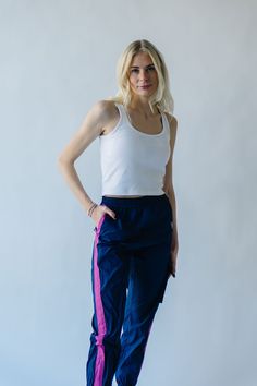 We couldn’t keep something this good to ourselves. These jogger style windbreaker pants our exclusive to us + come in inclusive sizing. They have a thick + flexible waistband with pink stripe down the sides of the legs. Pair with The Dua Windbreaker to make it a set. Details Model is wearing a small self/lining: 100% cotton Fabric Care Guide Here Sizing & Fit Measurements are approximate and taken while laying flat across the front. Not doubled. x-small: waist = 12"; length = 38"; inseam = 27" s Piper And Scoot, Style Windbreaker, Windbreaker Pants, Fashion Joggers, Small Waist, Pink Stripes, Fabric Care, Polyester Fabric, Cotton Fabric