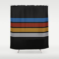 a black shower curtain with multicolored stripes