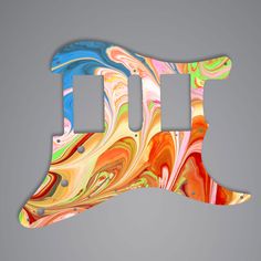 the letter j is made up of multicolored swirls on a gray background