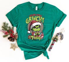 Feeling Extra Grinchy Today Christmas T-shirt, Funny Grinch Shirt, Grinchmas Shirt, Cute Christmas Shirt, Holiday Tshirt If you want any color which is not listed please contact us. HOW TO ORDER: 1) Please Select Shirt Size and Style 2) Please Select Shirt Color 3) Please Type Your Customization 4) Add to Your Cart CARE INSTRUCTIONS - - Machine wash cold, inside-out, gentle cycle with mild detergent and similar colors. - Use non-chlorine bleach, only when necessary. No fabric softeners. - Hang-d Extra Grinchy, Funny Grinch, Grinch Shirt, Grinch Shirts, Cute Christmas Shirt, Cute Christmas Shirts, Christmas T Shirt, Fabric Softener, Cute Christmas