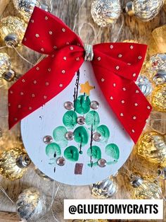 a christmas ornament with a red bow on it