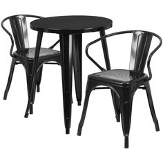 two black chairs and a table with one chair