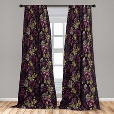 purple floral curtains hanging in front of a window