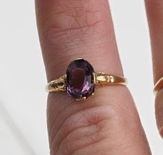 Vintage 1940s 10k gold purple oval stone ring. The ring is a size 5.75 and can be sized. Classic Oval Purple Birthstone Ring, Vintage Oval Amethyst Birthstone Ring, Vintage Oval Sapphire Birthstone Ring, Vintage Oval Sapphire Ring As Birthstone, Heirloom Oval Purple Birthstone Ring, Heirloom Purple Oval Birthstone Ring, Vintage Oval Amethyst Ring In 14k Gold, Antique Oval Amethyst Promise Ring, Vintage Oval Solitaire Amethyst Ring