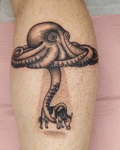 an octopus and pig tattoo on the leg