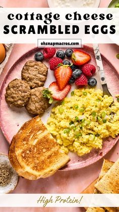 a pink plate topped with eggs, toast and fruit next to another plate full of food