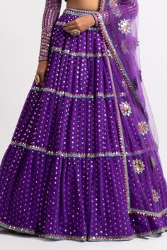 Purple multi tier lehenga with sequins splash all-over. Paired with sweetheart neckline hand embroidered blouse and mirror work dupatta.
Component: 3
Pattern: Embroidered
Type Of Work: Sequins, Mirror
Neckline: Sweetheart
Sleeve Type: Straight Full
Fabric: Lehenga and Blouse: Georgette; Dupatta : Net; Lining: Silk Blend 
Color: Purple
Other Details: 
Cutwork hem dupatta
High waisted tiered lehenga
Back tassel tie-up blouse
Occasion: Destination Wedding - Aza Fashions Festive Purple Sets With Motifs, Semi-stitched Purple Lehenga With Motifs, Purple Bollywood Lehenga With Motifs, Purple Semi-stitched Sharara With Motifs, Bollywood Style Purple Lehenga With Motifs, Purple Lehenga With Motifs For Diwali, Festive Purple Lehenga With Motifs, Bollywood Style Purple Choli With Motifs, Semi-stitched Purple Sharara With Motifs