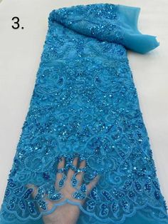 This high quality Fabric is measured in 5 Yards With Embroidered Beading and Sequin. It is soft, very delicate and beautiful. This high Quality Fabric is made with Fashion embroidered rhinestones can be used in making party wedding dresses, skirts, shawls, scarves and other other fashion apparels as you would like. Size : Length : 5 yards (180 inch). Width: 50 inch (Please allow slight deviation for the measurement data ,±1 inch) Material: 100% Polyester, Tulle Lace Fabric, Eco-Friendly embroide Champagne Embellished Fitted Sequin Fabric, Elegant Embellished Gold Sequin Fabric, Fitted Gold Embroidered Sequin Fabric, Champagne Embellished Sequin Fabric, Party-ready Embellished Sequin Fabric, Handmade Fabric, Tulle Lace, Designer Fabric, Wedding Party Dresses