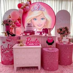 a barbie birthday party with pink decorations and balloons