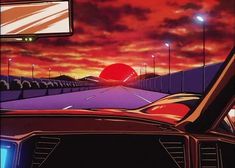 an image of a car driving down the road at sunset or sunrise with red and orange clouds