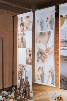 two large banners with pictures of people on them in front of a brick wall and flowers