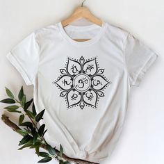 This stylish unisex '7 Chakras Mandala' white t-shirt fits like a well-loved favorite. Super soft cotton and excellent quality print make one fall in love with it over and over again.Each petal of this chakra mandala contains a Sanskrit symbol of a mantra (seed sound) corresponding to each of the 6 chakras, from the root chakra (लं - LAM) to the third eye chakra (ॐ - OM). The Center of the lotus represents the crown chakra (7th chakra).This t-shirt is a perfect gift for anyone who loves chakras, Sanskrit Symbols, Sacral Chakra Healing, Chakra Mandala, Yoga Apparel, Chakra Affirmations, Chakra Colors, Chakra System, Chakra Yoga, Seven Chakras