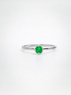 An Emerald Ring crafted from 925 silver is a stunning piece of jewelry that combines the elegance of the precious gemstone with the affordability and durability of sterling silver. Emerald, the birthstone for May, is renowned not only for its breathtaking green hue but also for its metaphysical and healing properties. This gemstone is believed to possess various attributes, including promoting love, compassion, and harmony within relationships. It is also associated with enhancing mental clarity, creativity, and intuition, making it a popular choice for those seeking personal growth and self-improvement. In the realm of physical healing, emeralds are thought to support the heart, liver, and immune system, contributing to overall well-being. Wearing an Emerald Ring can symbolize rebirth and Green Gemstone Stackable Rings For May Birthstone, Formal Emerald Gemstone Stackable Rings, Green Stackable Rings For Formal May Birthstone, Green Minimalist Sterling Silver Ring, Green Sterling Silver Minimalist Ring, Green Gemstone Sterling Silver Birthstone Ring, Green Sterling Silver Rings With Prong Setting, Green Birthstone Ring With Bezel Setting, Green Birthstone Ring With Bezel Setting, Open Design