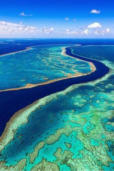 an aerial view of the great barrier reef and surrounding coral reefs in the blue water