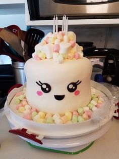 a white cake with marshmallows on it