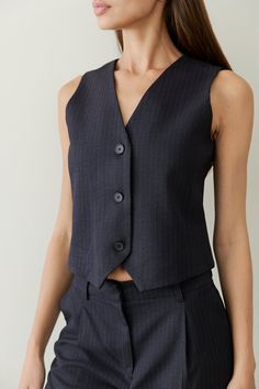 Information Featuring a traditional slim silhouette, The Kenz Vest creates a streamlined and tailored look that is both modern and timeless. Featuring a front button closure and added lining for comfort, this waistcoat vest is a classic element of formal wear, providing a touch of sophistication and style to any outfit. It can also be worn as a standalone piece with The Kenz Pants for a modern, tailored-casual look. Details Self: 66% Polyester, 32% Rayon, 2% Spandex Lining: 100% Polyester Fitted Pinstripe Vest, Lifestyle Brands, Formal Wear, Shoe Brands, Jumpsuit Dress, Casual Looks, Jumpsuit, Womens Sizes, Spandex