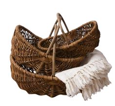 two wicker baskets sitting next to each other