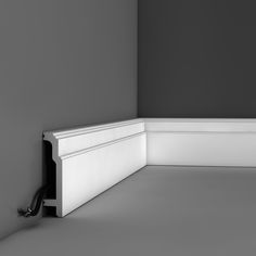 the corner of a room with a black and white photo