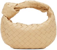 Intrecciato-woven grained lambskin and calfskin top handle bag in beige. · Integrated carry handle with knotted detailing · Zip closure · Tonal leather lining · Gold·-tone hardware · H8 x W10 x D3 in Supplier color: Porridge | Bottega Veneta Beige Mini Jodie Bag Beige Leather Bags With Interwoven Design, Bottega Mini Jodie, Bottega Jodie, Mini Jodie Bag, Jodie Bag, Bottega Bag, Bottega Veneta Jodie, Mini Jodie, Mini Outfit