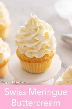 cupcakes with white frosting on top and the words swiss meringue buttercream